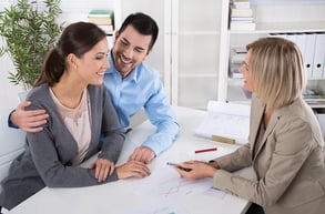 Professional business meeting_ young couple as customers and an adviser for finance, inves